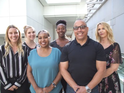 Team members smiling together