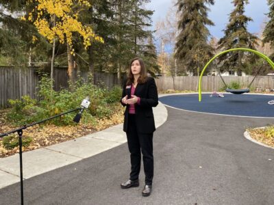 Lisa Aquino with Catholic Social Services speaks with reporters outside Clare House, Oct. 9, 2020. (Paula Dobbyn / ADN)