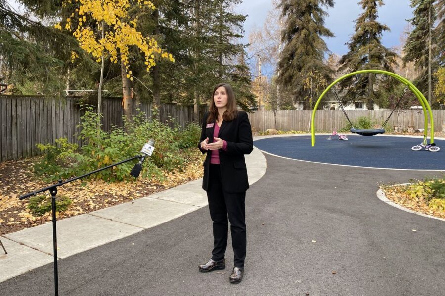 Lisa Aquino with Catholic Social Services speaks with reporters outside Clare House, Oct. 9, 2020. (Paula Dobbyn / ADN)